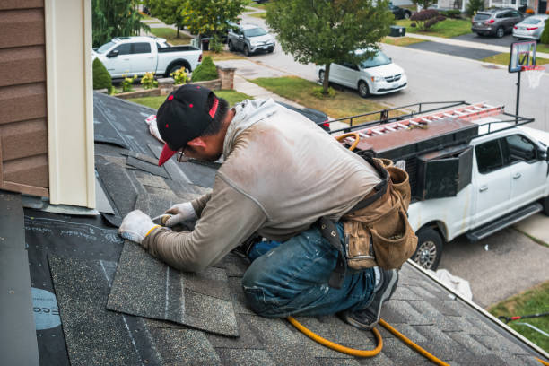Professional Roofing technician working in Woolstock, IA